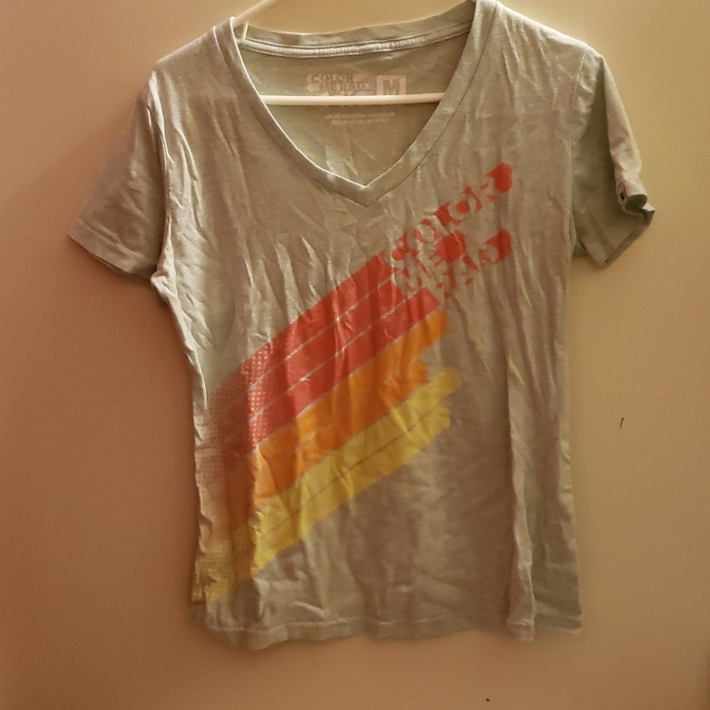 Light blue/green t-shirt.